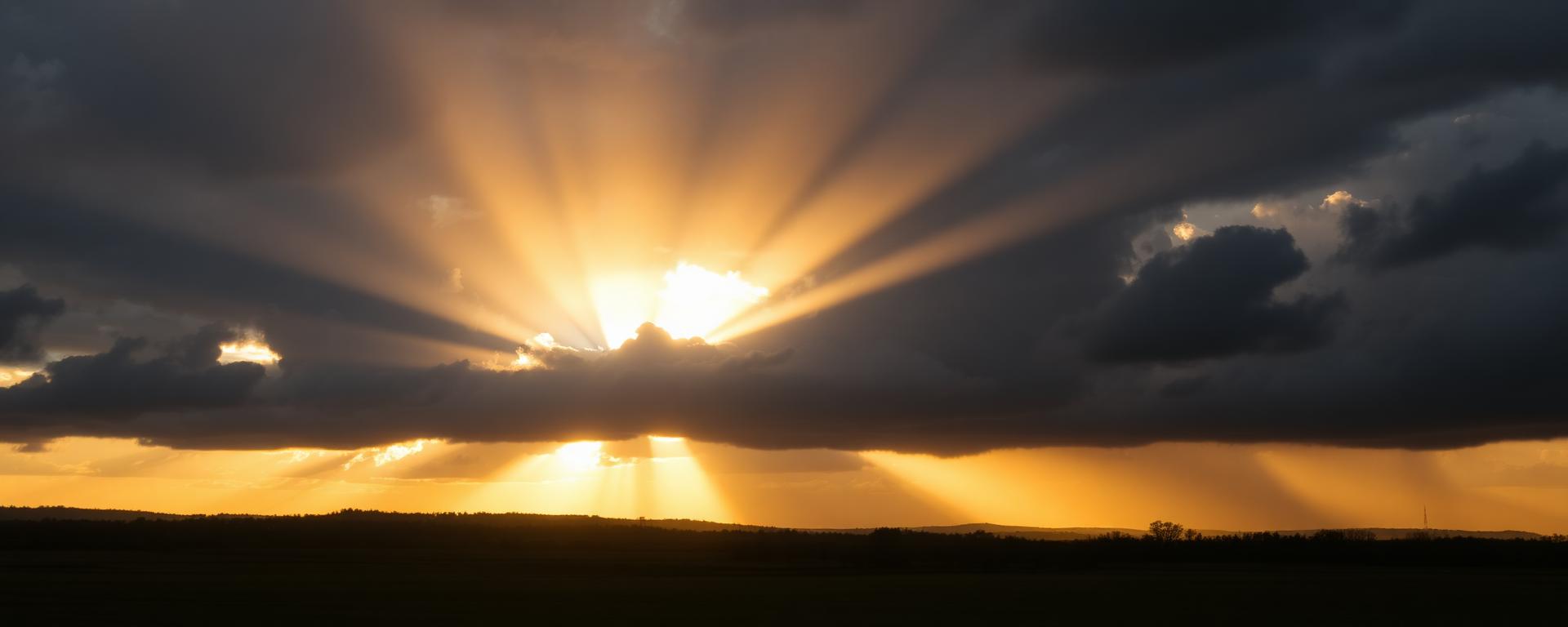 Sunrise breaking through storm clouds